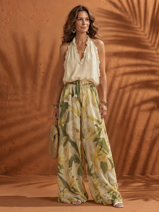 Solange | Conjunto de blusa de cuello halter y pantalón de pierna ancha con estampado floral